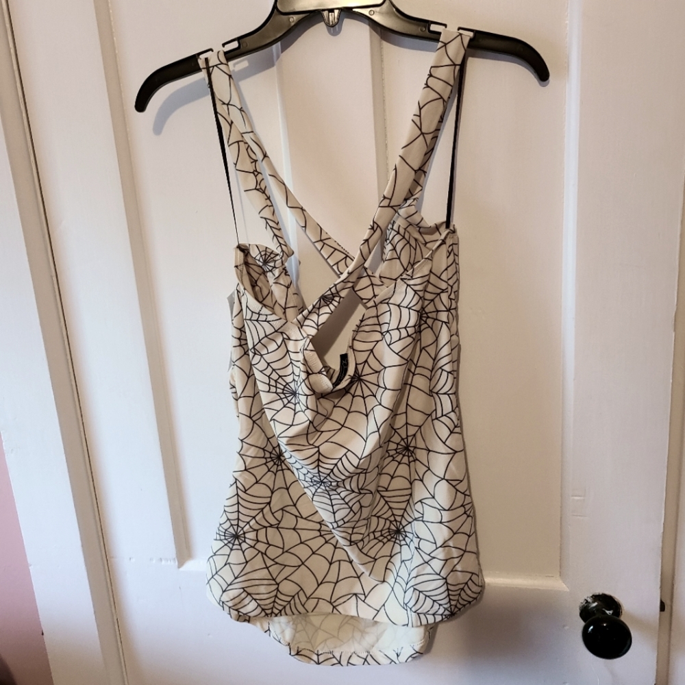 Spider web cream and black cross top. Never worn